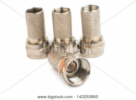 gilded television connectors on a white background