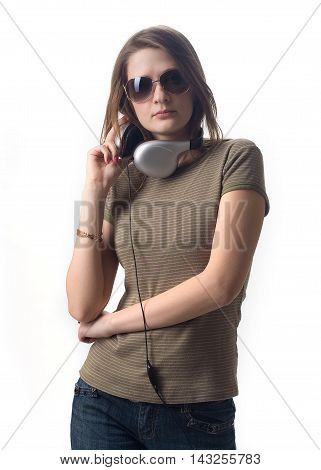 Serious girl in headphones smile on white background