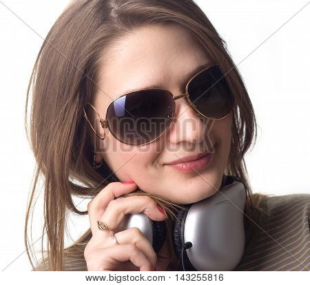 A girl in headphones smile on white background