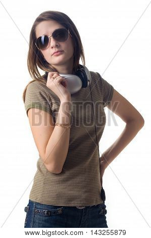 Serious girl in headphones on white background