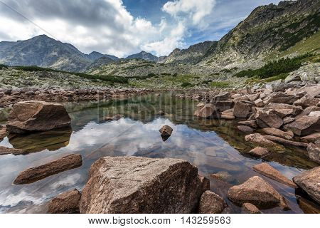 Reflection of Musala peak in Musalenski lakes,  Rila mountain, Bulgaria