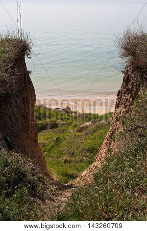 Steep coast of the Black Sea. The descent to the beach.
