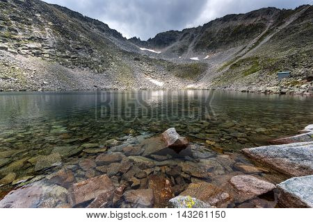 Clear waters of Ledenoto (Ice) Lake and Musala Peak, Rila mountain, Bulgaria
