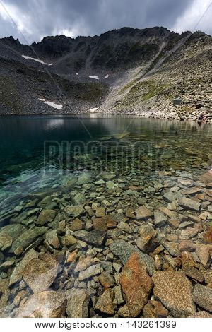 Ledenoto (Ice) Lake and clouds over Musala Peak, Rila mountain, Bulgaria
