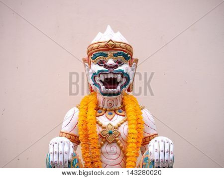 Hanuman statue with yellow garland thailand style