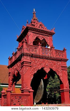 Lamphun Thailand - December 28 2012: Red drum and bell tower at Wat Phra That Haripunchai Maha Viham