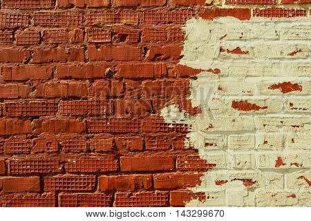 Texture of old brick wall surface. Bicolor wall. Old brick wall texture background