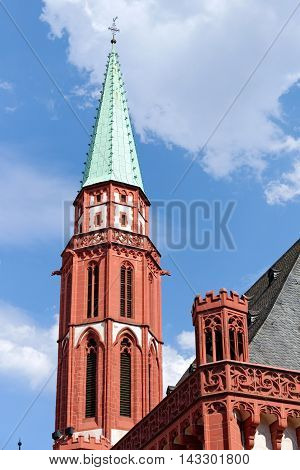 The tower of the old St Nicholas Church a Lutheran medieval church on Romerberg square the historic heart of Frankfurt am Main Germany.