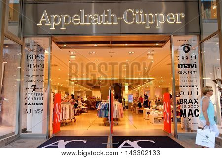 FRANKFURT AM MAIN GERMANY - AUGUST 7 2015: Appelrath Cupper store on Zeil at night. Fashion retailer with 13 stores throughout Germany offers large variety of brands.