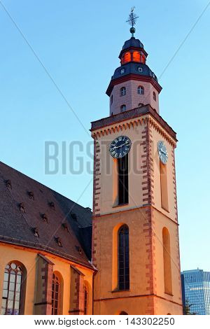 Katharinenkirche (St. Catherine' church) in the old city center at Hauptwache plaza illuminated in the evening.