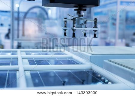 production of solar panels, Industrial robot working in factory,Conveyor Tracking Controller of robotic hand.