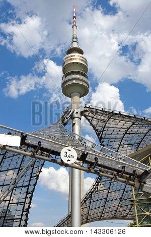 MUNICH GERMANY - AUGUST 4 2015: Detail of the Olympic Tower (Olympiaturm) in Olimpiapark. It was built for the 1972 Summer Olympics. It has an overall height of 291m and a weight of 52500 tons.