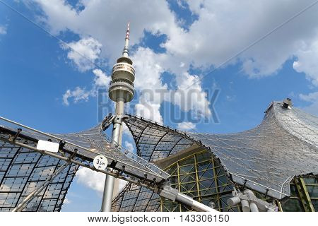 MUNICH GERMANY - AUGUST 4 2015: Detail of the Olympic Tower (Olympiaturm) in Olimpiapark. It was built for the 1972 Summer Olympics. It has an overall height of 291m and a weight of 52500 tons.