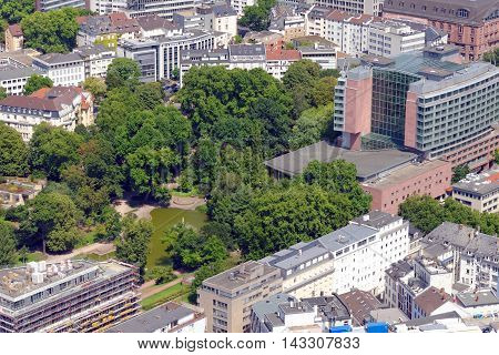 FRANKFURT AM MAIN GERMANY - AUGUST 6 2015: Aerial view of Hilton hotel and Bockenheimer Anlage part of the annular green area around the city formed by the Frankfurter ramparts.