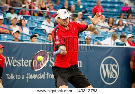 Mason, Ohio - August 16, 2016: John Isner in a match at the Western and Southern Open in Mason, Ohio, on August 16, 2016.