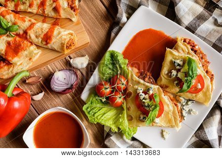 Stuffed Bolognese Pancakes With Minced Meat And Vegetable With Tomato Sauce