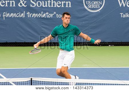 Mason Ohio - August 16 2016: Bernard Tomic in a match at the Western and Southern Open in Mason Ohio on August 16 2016.
