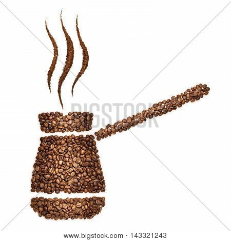 Creative still life of a copper Turkish coffee pot turk made of coffee beans isolated on white.