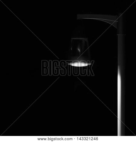 Bright Lit Outdoor Lantern Lamp Pole Post, Lonely Concept Solitude Metaphor, Illuminated Window Light, Vertical Deserted Night Park Scene Closeup, Black Isolated Copy Space Background