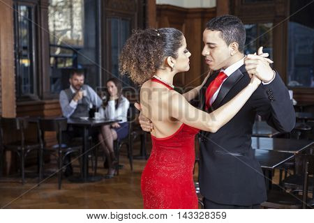 Passionate Tango Dancers Performing While Mid Adult Couple Datin