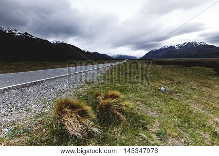Long exposure capturing the motion of clouds and grass blew by the wind.