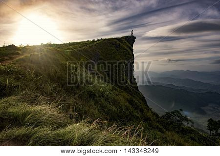 Sunrise scene with the peak of mountain and cloudscape at Phu chi fa in ChiangraiThailand