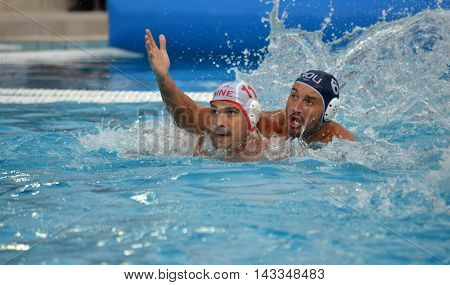 Budapest, Hungary - Jul 17, 2014. KLIKOVAC Filip (MNE, 11) against BUSILA Dan Andrei (ROU, 6). The Waterpolo European Championship was held in Alfred Hajos Swimming Centre in 2014.