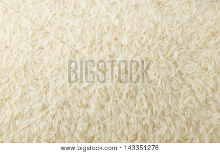 Cuisine and Food Background of Uncooked White Long Rice Basmati Rice or Jasmine Rice.