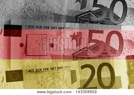 Euro banknotes, switch and German flag - Finance concept