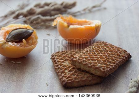 cookies abricots and ears on wooden table