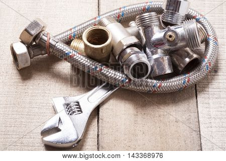 Construction tools on wooden table .Sanitary engineering background . Top view.