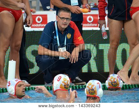 Budapest, Hungary - Jul 17, 2014. Montenegro's PEROVIC Ranko head coach talking about the tactics. The Waterpolo European Championship was held in Alfred Hajos Swimming Centre in 2014.