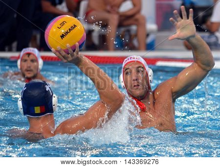 Budapest, Hungary - Jul 17, 2014. IVOVIC Aleksandar (MNE, 9) defending against GHIBAN Alexandru (ROU, 11). The Waterpolo European Championship was held in Alfred Hajos Swimming Centre in 2014.