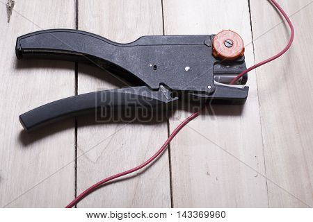 Set of electrical tool on wooden background. Accessories for engineering work, energy concept
