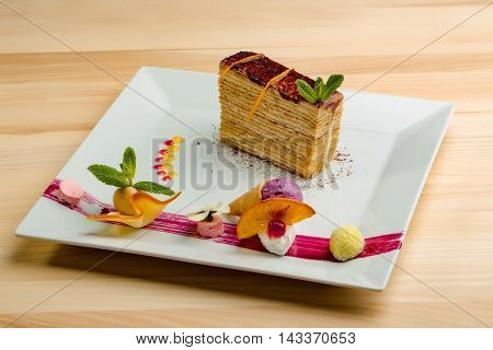 Dessert - Cake with chocoltae Icing and Fresh Mint. Sweet food calorie