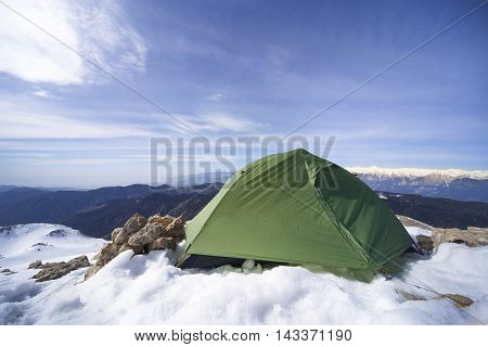 Camping on the top of the mountain in winter.