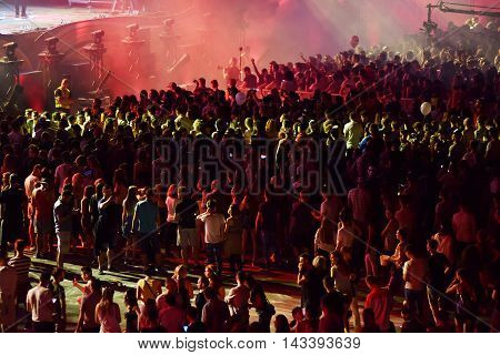Crowd Of People Dancing At A Concert