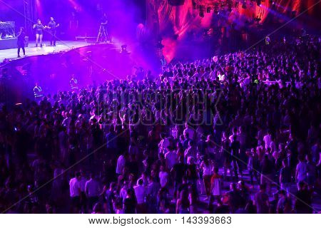 Crowd Of People Dancing At A Concert