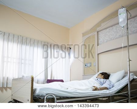 Woman Lying Down patient in hospital bed