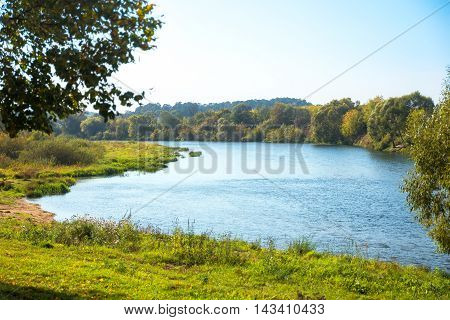 Bank of the river on sunny day.
