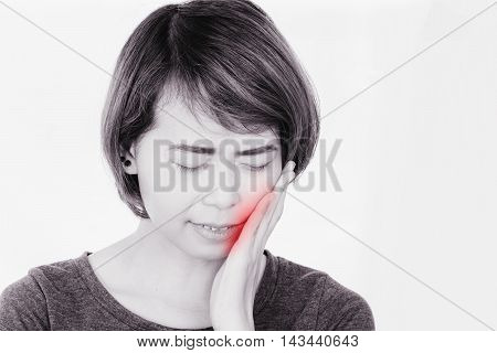 Woman have toothache on white background, symptoms of toothaches typically involve some kind of ache or pain in the jaws or gums