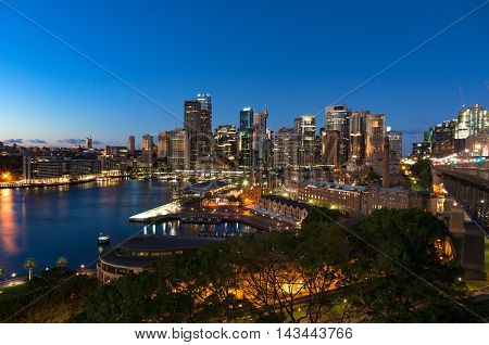 Aerial view of Sydney Central Business District skyscrapers on dusk. Urban landscape view from above. Circular Quay Australia