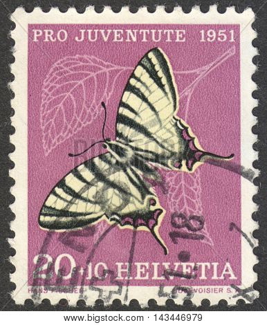 MOSCOW RUSSIA - CIRCA JULY 2016: a post stamp printed in SWITZERLAND shows a butterfly (Iphiclides podalirius) the series 