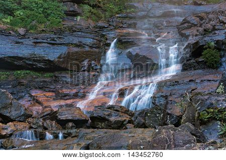 Wentworth Falls lower section waterfall cascade. Water flowing over rocks. Wentworth Falls Blue Mountains National Park Australia