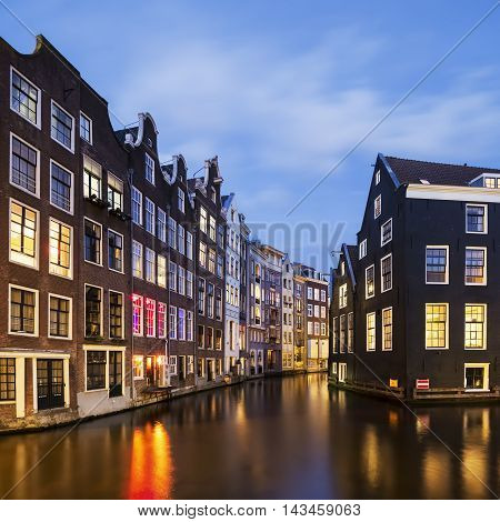 View of famous amsterdam canal by night Netherlands