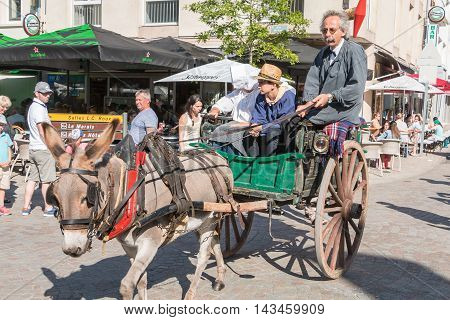 Antique Cart Pulled By A Donkey In The Streets Of The City