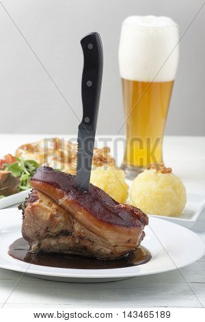 frankonian schaeufele roasted pork portion with beer