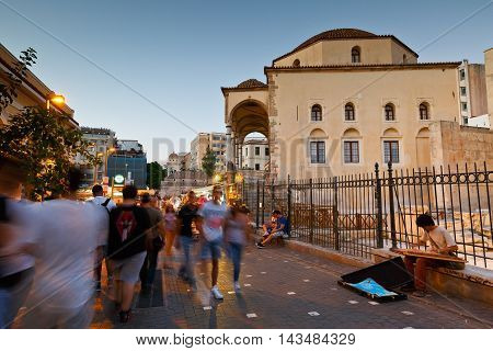 ATHENS, GREECE - AUGUST 20, 2016: Busking musician at the mosque in Monastiraki square in Athens on August 20, 2016.