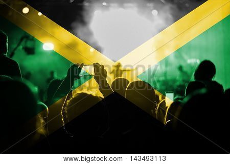 reggae live music concert with blending Jamaica flag on fans