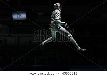 RIO DE JANEIRO, BRAZIL - AUGUST 12, 2016: Miles Chamley-Watson competes in the Men's team foil of the Rio 2016 Olympic Games at the Carioca Arena 3